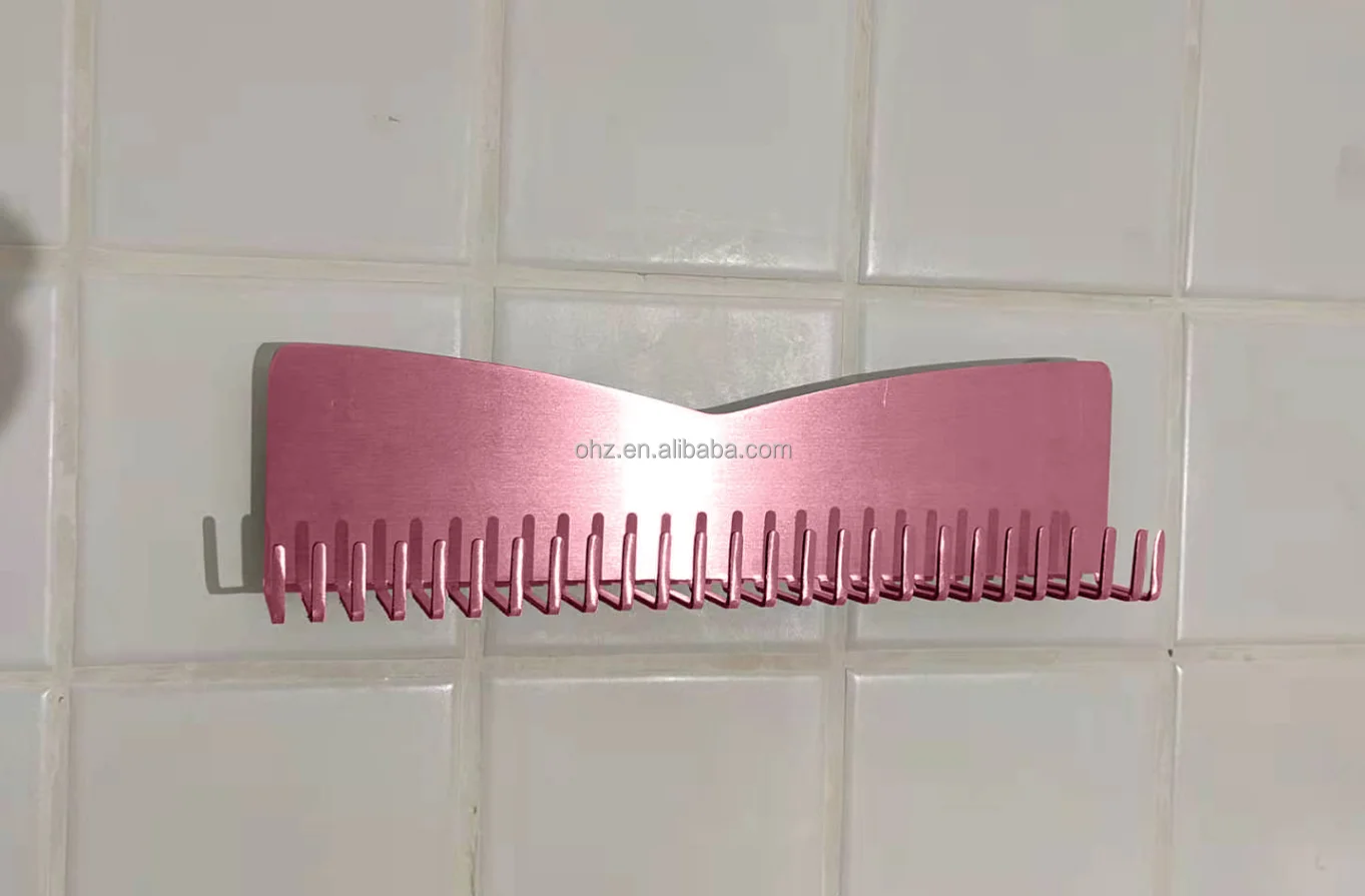 Close-up of gold finish and hooks on hair extension stand