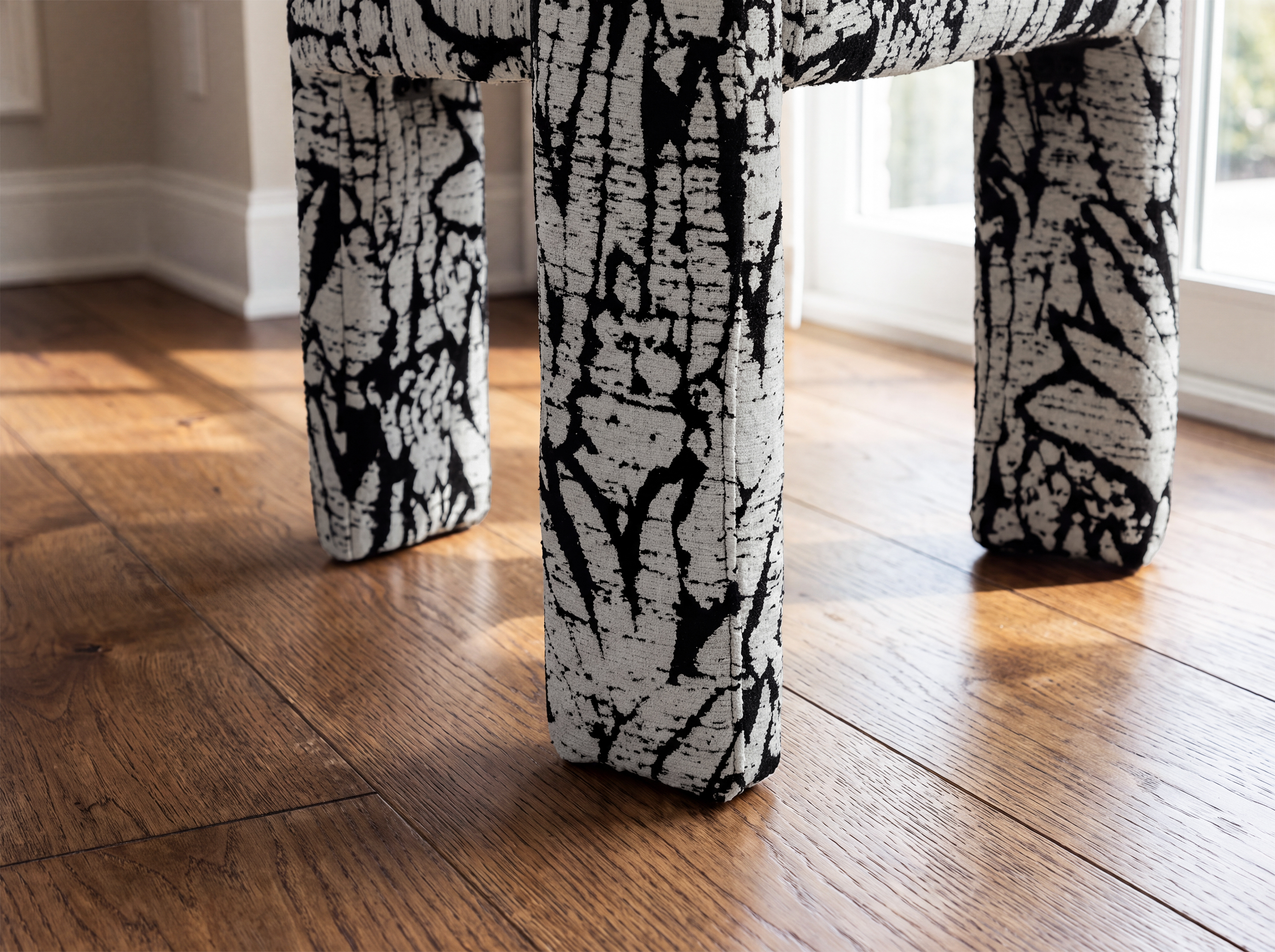 Upholstered legs and sturdy three-leg frame of the Dove Dining Chair