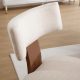 Close-up of the curved fabric backrest and wood support on the payson upholstered dining chair.
