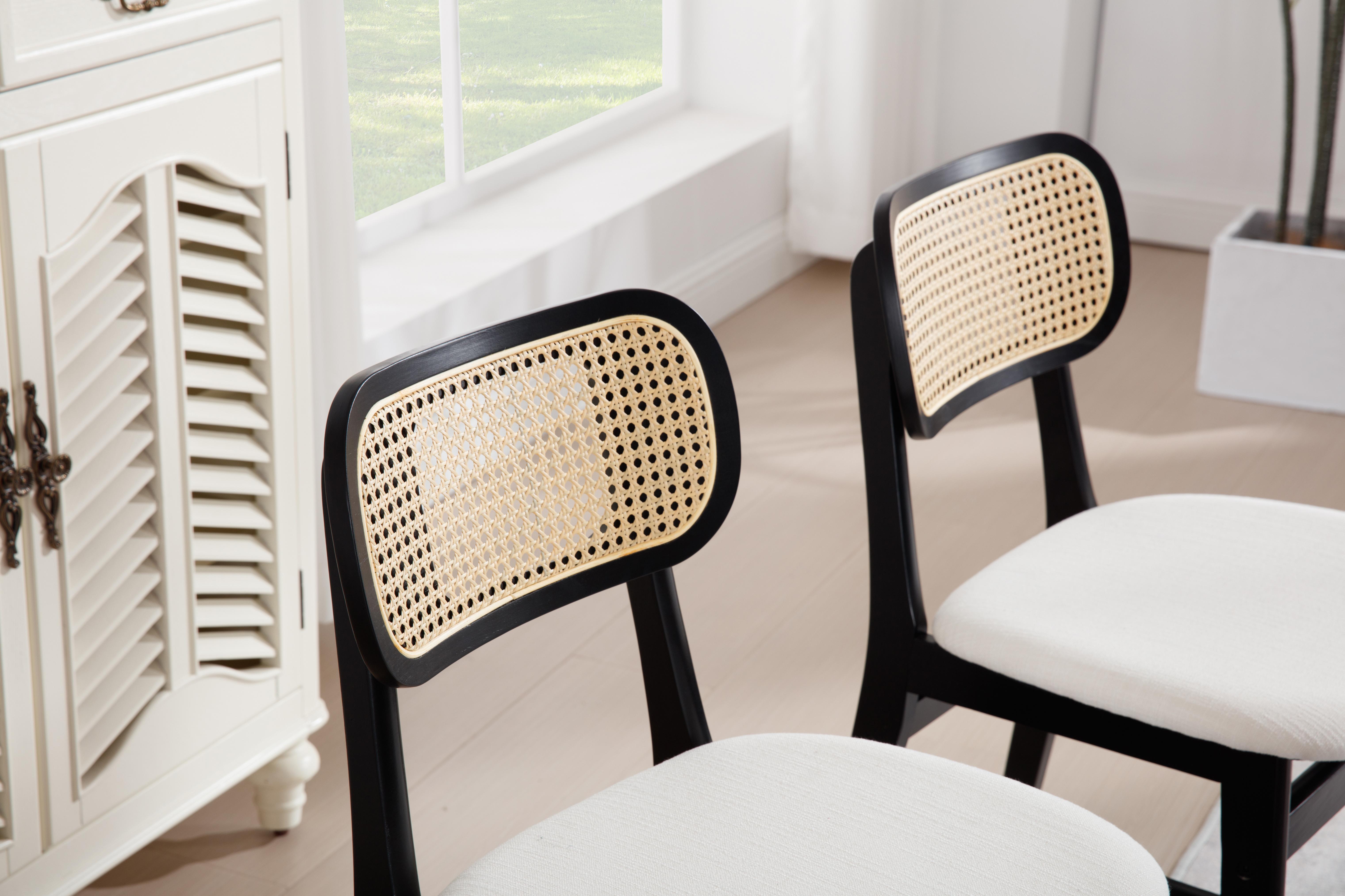 Handwoven cane dining chair backrest with an open breathable weave