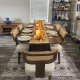 Modern wood dining chairs with woven cane backrests and ivory cushions surrounding a dark wood dining table in a contemporary home