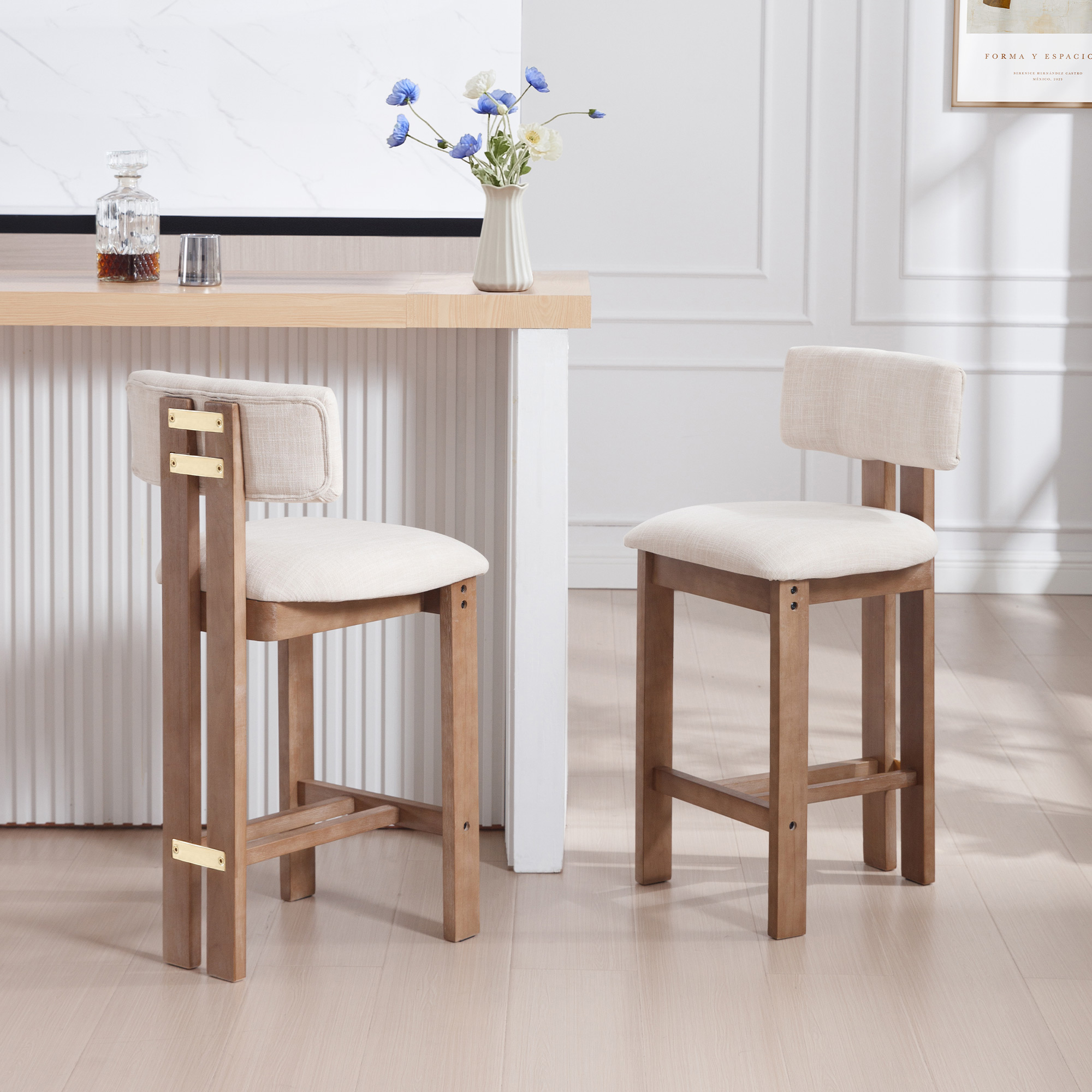 beige upholstered counter stools set of 2 beside modern kitchen island with solid wood legs in bright dining space