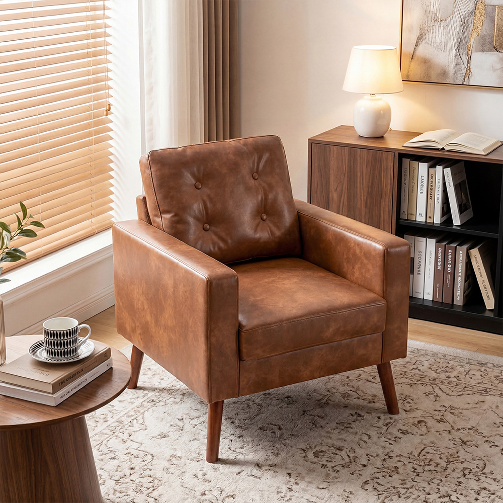 luxury sofa chair in brown leather with button tufted backrest and wood legs styled in a cozy modern living room
