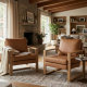 Affordable armchair with brown leather upholstery and solid wood frame, styled beside a window in a calm bedroom setting