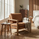 Affordable armchair cushion detail showing soft brown leather upholstery with comfortable padded seat support
