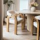 A mid century modern dining chairs set of 2 styled with a round fluted wooden table.
