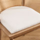 modern farmhouse upholstered dining chairs with thick padded seat cushion and natural wood frame close-up detail
