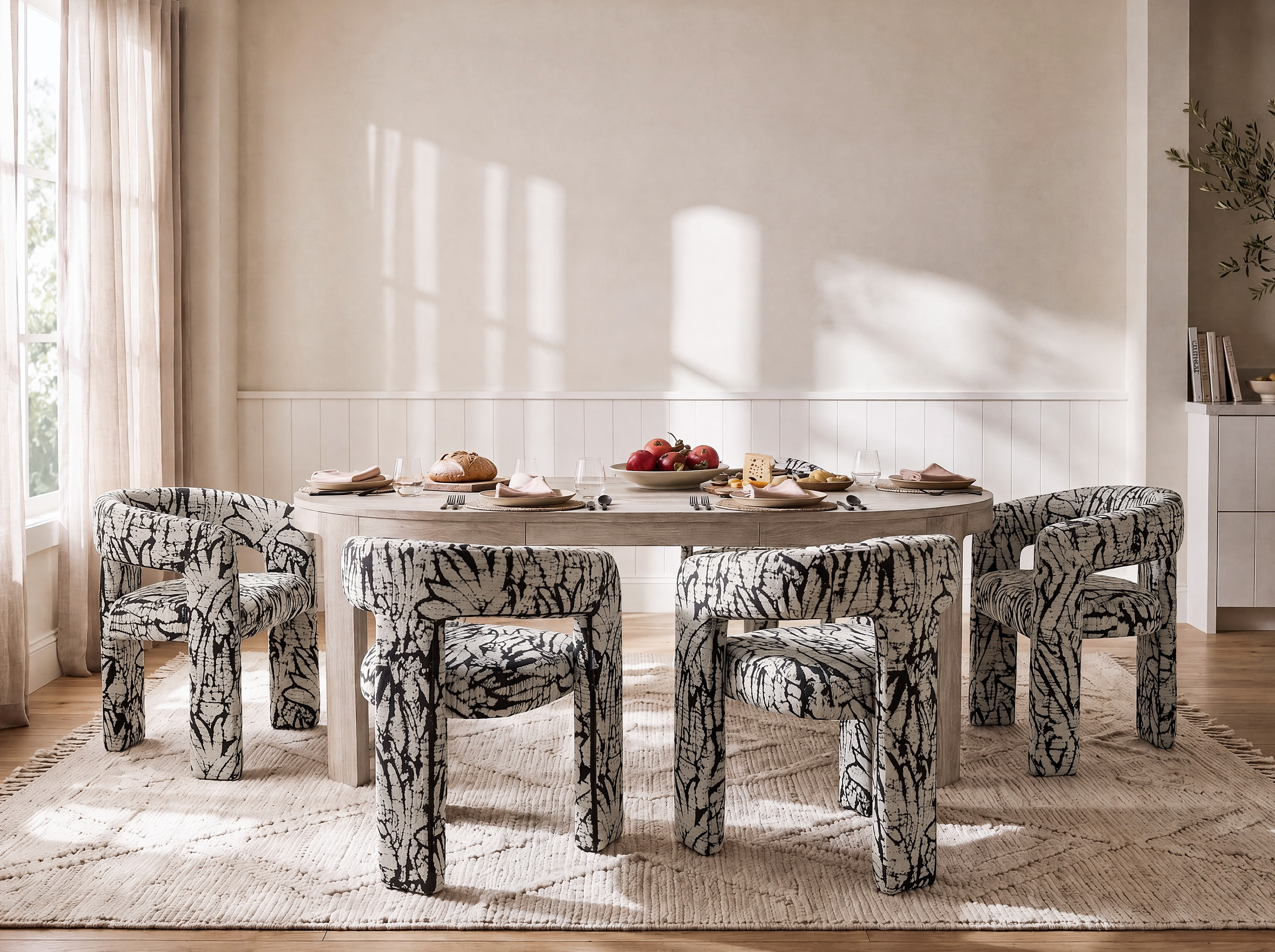Dove upholstered dining chairs paired with a light wood dining table