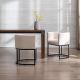 Industrial upholstered dining chairs with beige fabric seats and black metal base, side and rear view by dining table