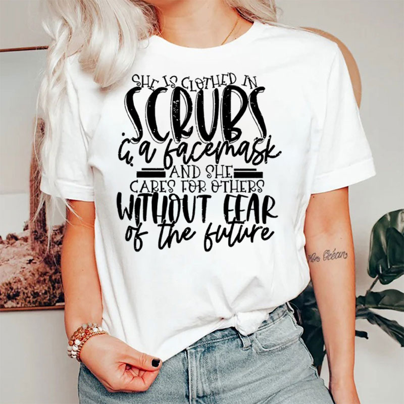 She Is Clothed In Scrubs & A Facemask Nurse T-Shirt