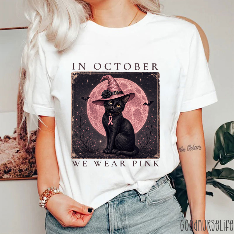 In October We Wear Pink Witch Black Cat Pink Moon Breast Cancer Awareness Teacher T‑Shirt