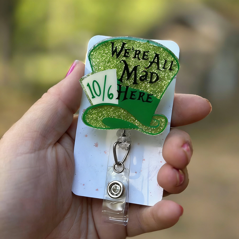 We Are All Mad Here Badge Reel