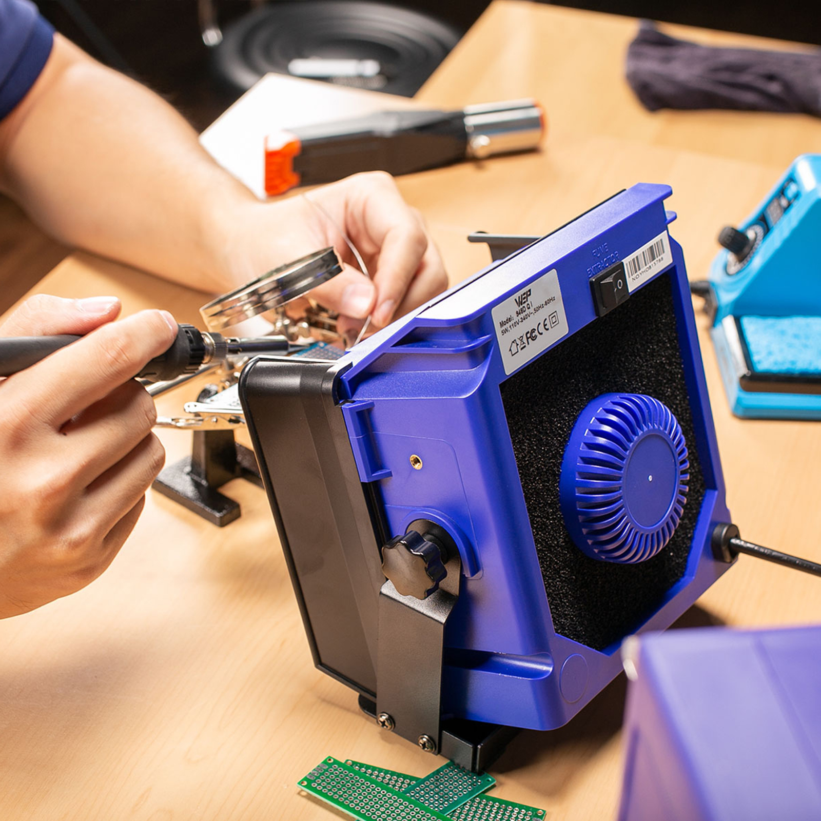 Using the WEP fume extractor to extract harmful fumes while soldering