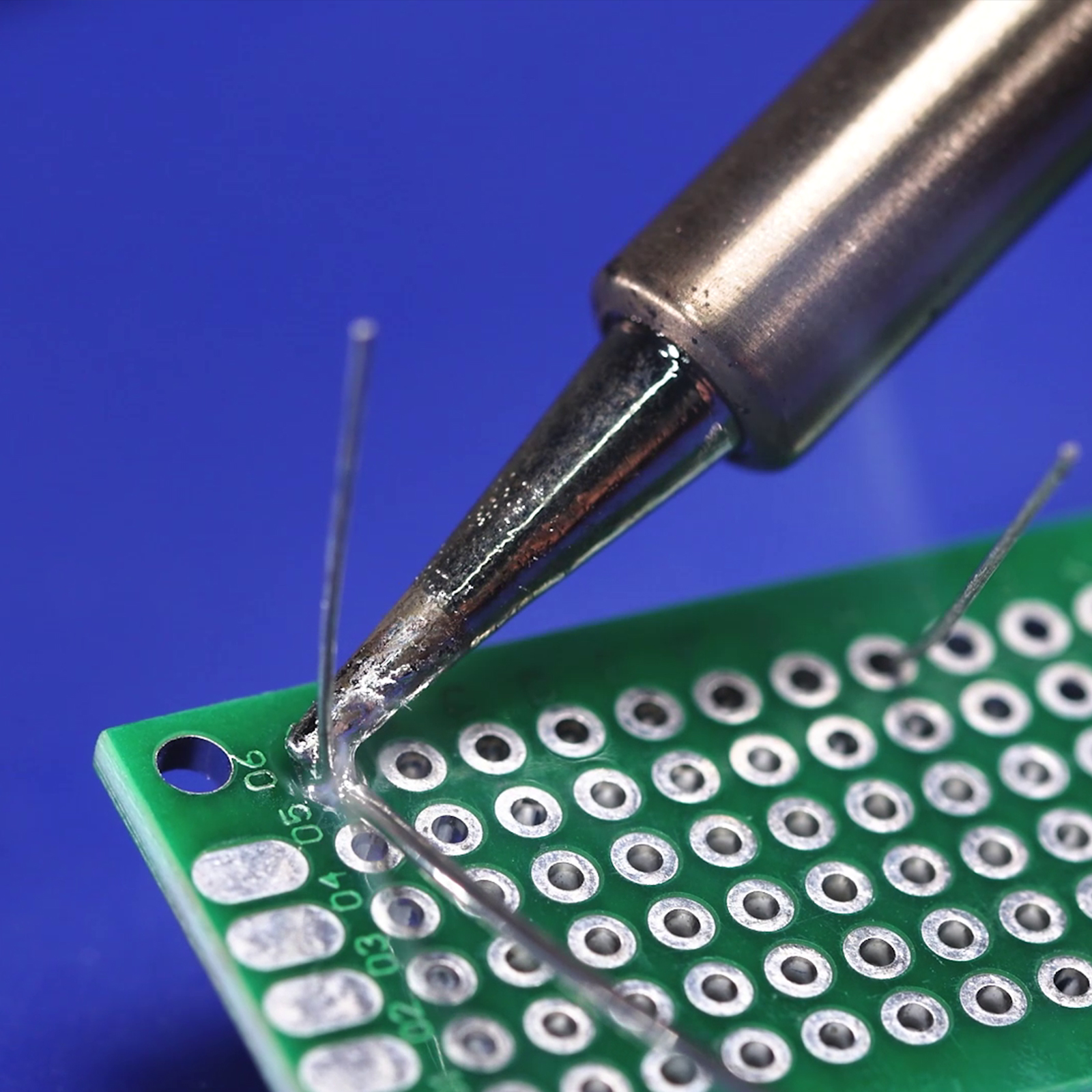 Using a WEP soldering station with a temperature control function to solder a through-hole resistor 