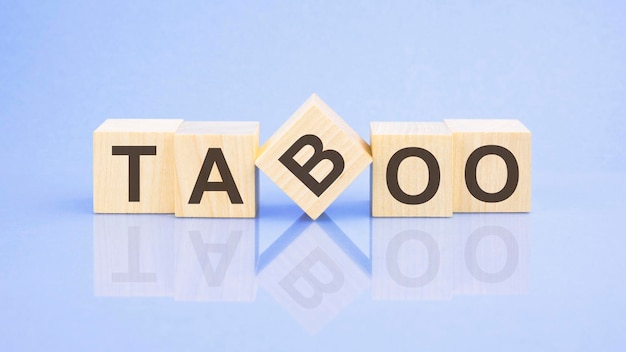 Photo text taboo letters by on woodens blocks on pale lilac background in concept of business and corporation
