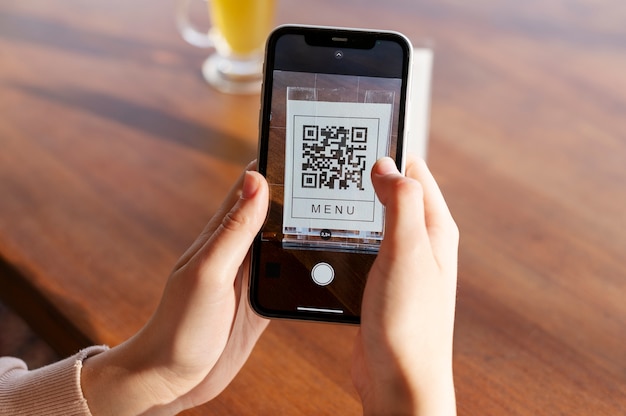 Free photo person scanning qr code