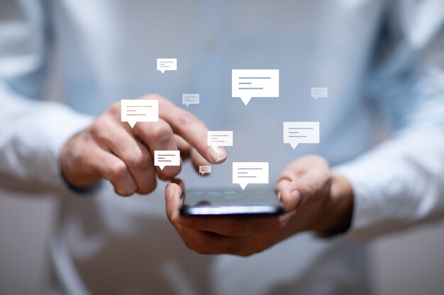 Photo business man holding smart phone with letter signs