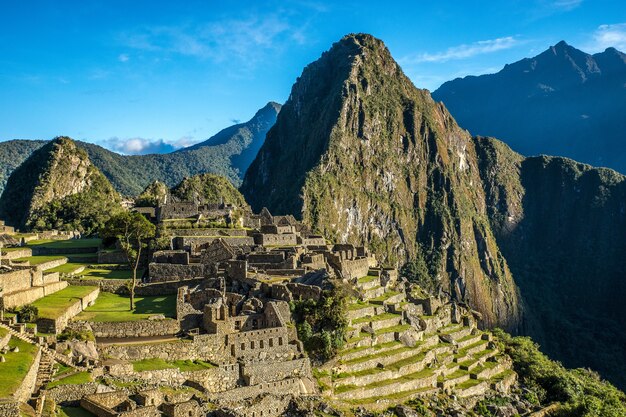 Free photo aerial shot of the beautiful village by the mountain captured in machu picchu, peru