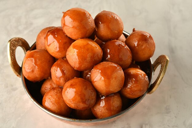 Photo luqaimat or lokma. freshly fried lokma  piled high a popular middle eastern dessert