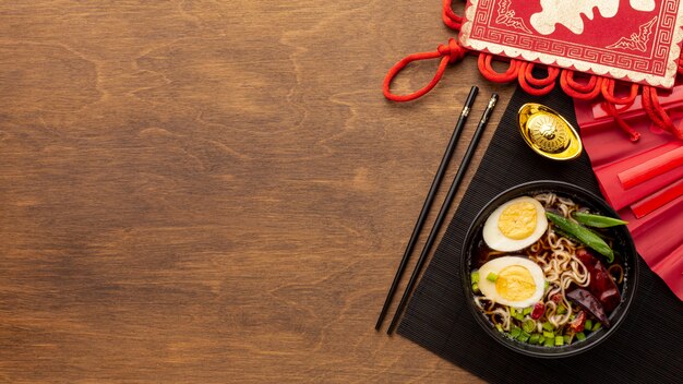 Free photo chinese new year dish on wooden background