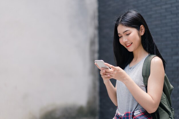 Free photo traveler asian woman direction on location map in beijing, china