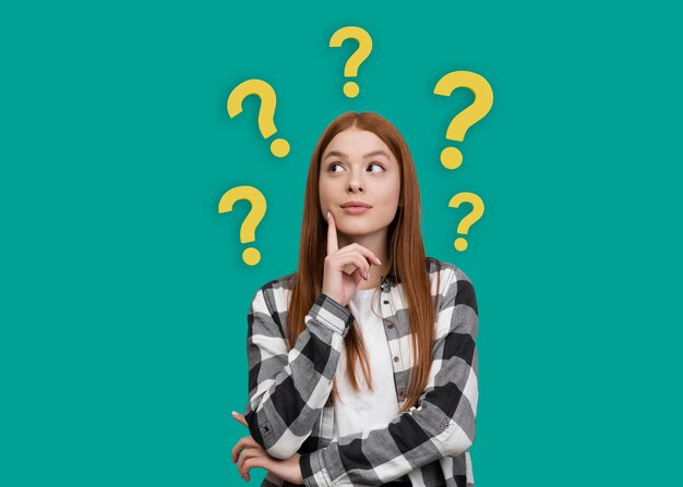 Free photo medium shot woman posing with question marks