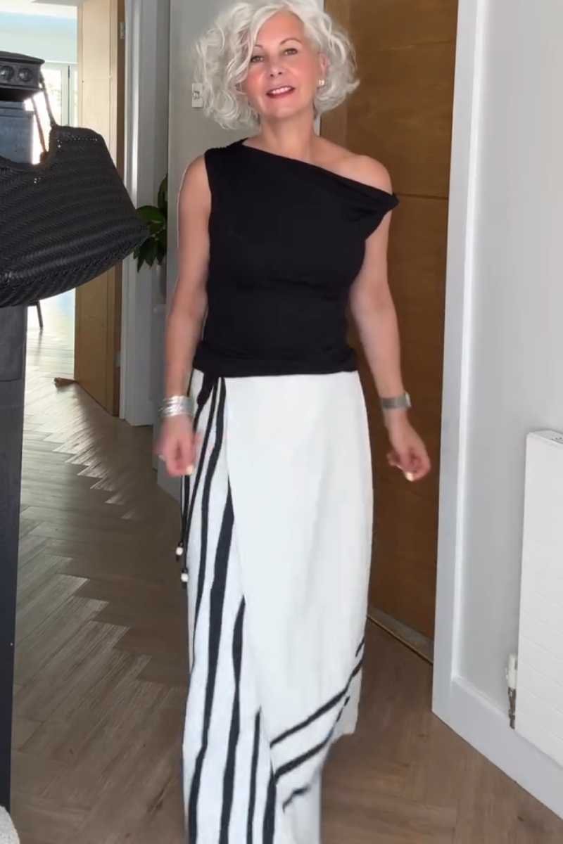 Women's Summer Maxi Skirt Outfit: Black One-Shoulder Top and Striped Maxi Skirt