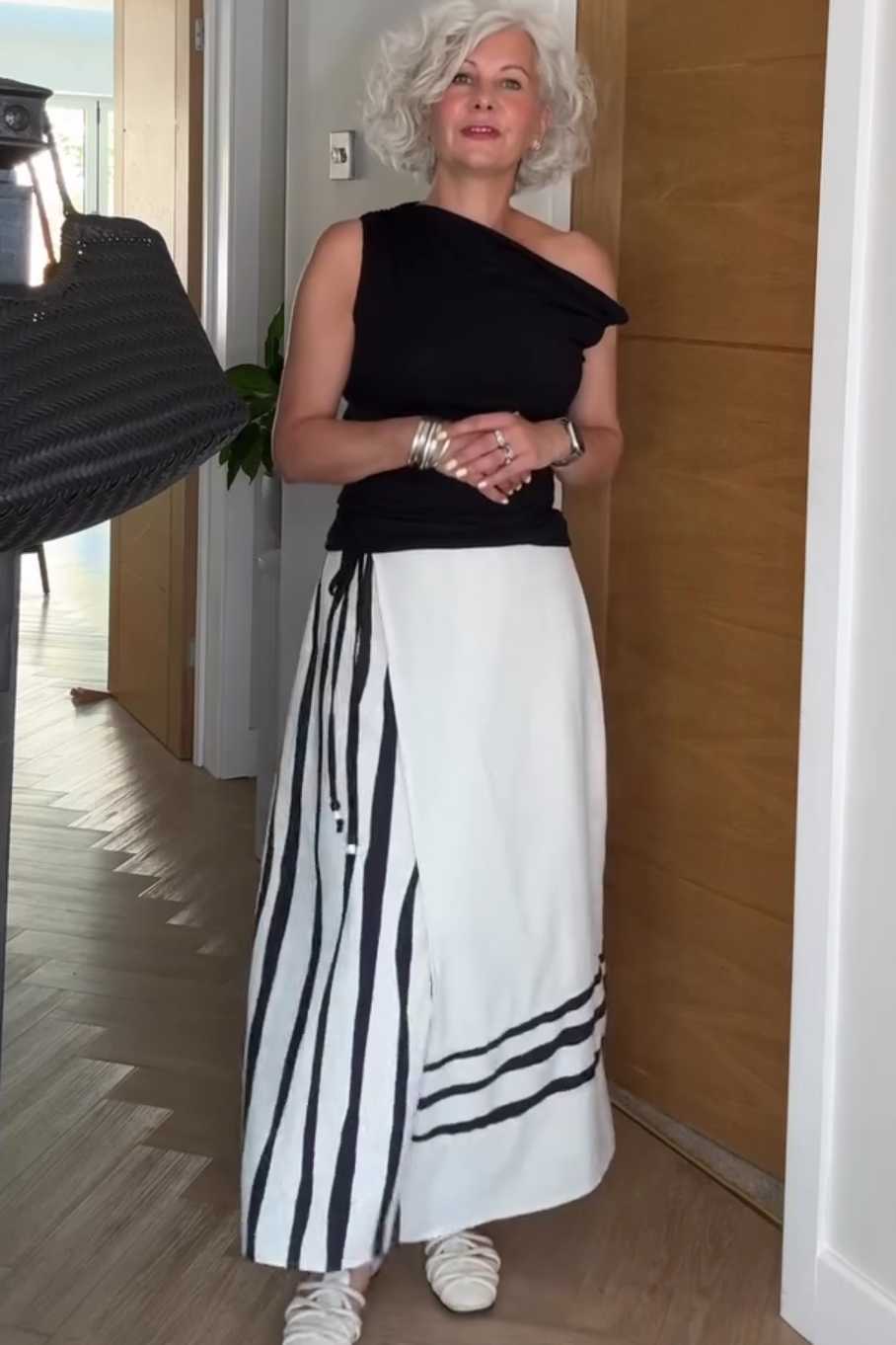 Women's Summer Maxi Skirt Outfit: Black One-Shoulder Top and Striped Maxi Skirt