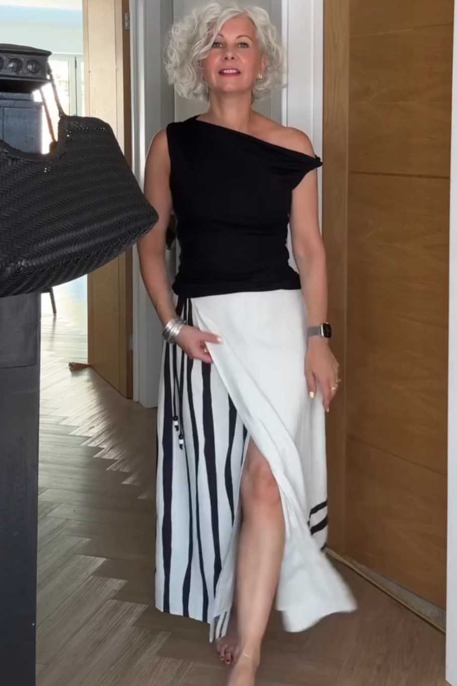 Women's Summer Maxi Skirt Outfit: Black One-Shoulder Top and Striped Maxi Skirt