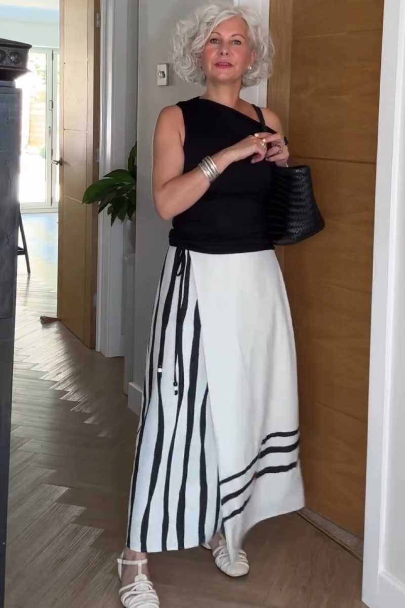 Women's Summer Maxi Skirt Outfit: Black One-Shoulder Top and Striped Maxi Skirt