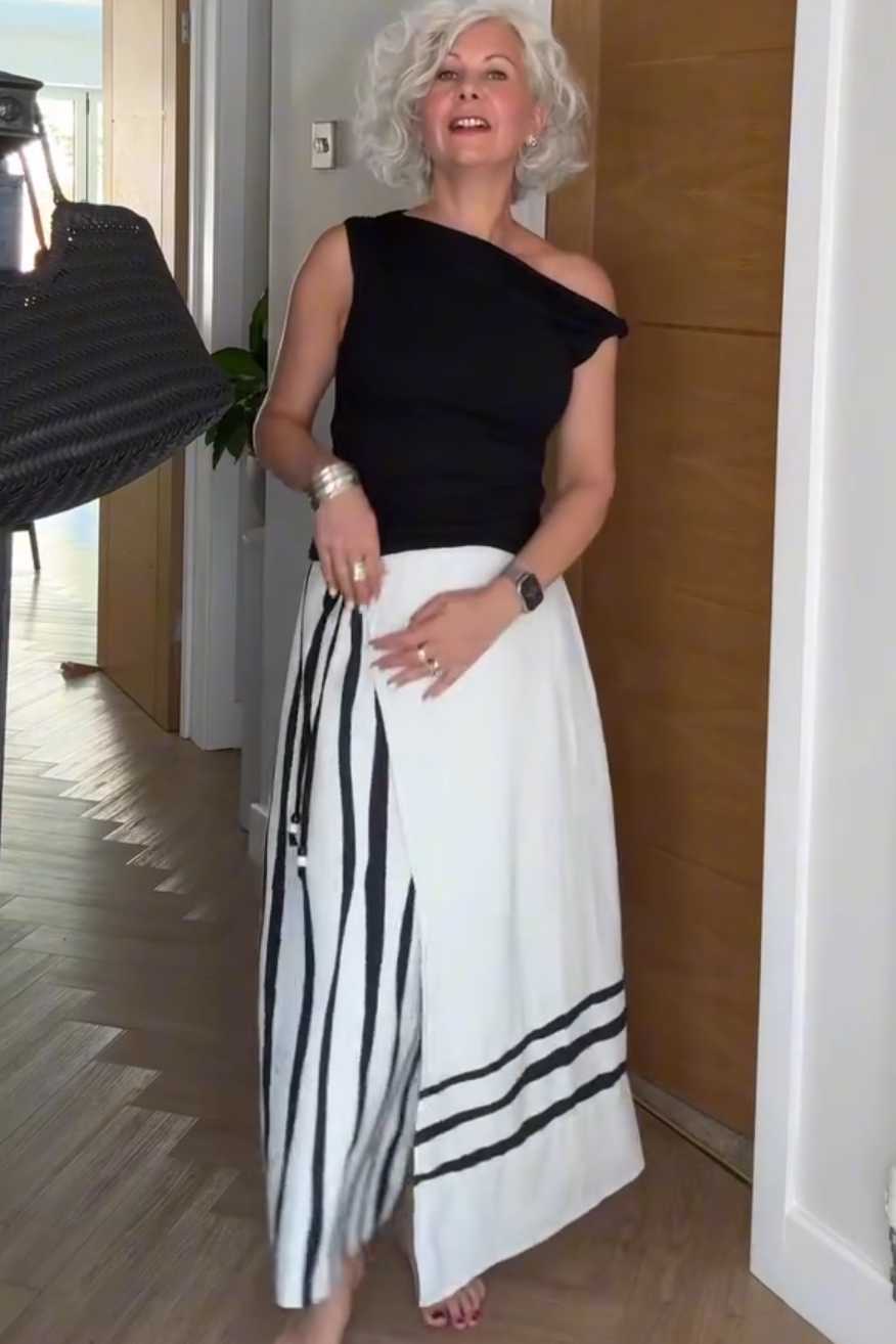 Women's Summer Maxi Skirt Outfit: Black One-Shoulder Top and Striped Maxi Skirt