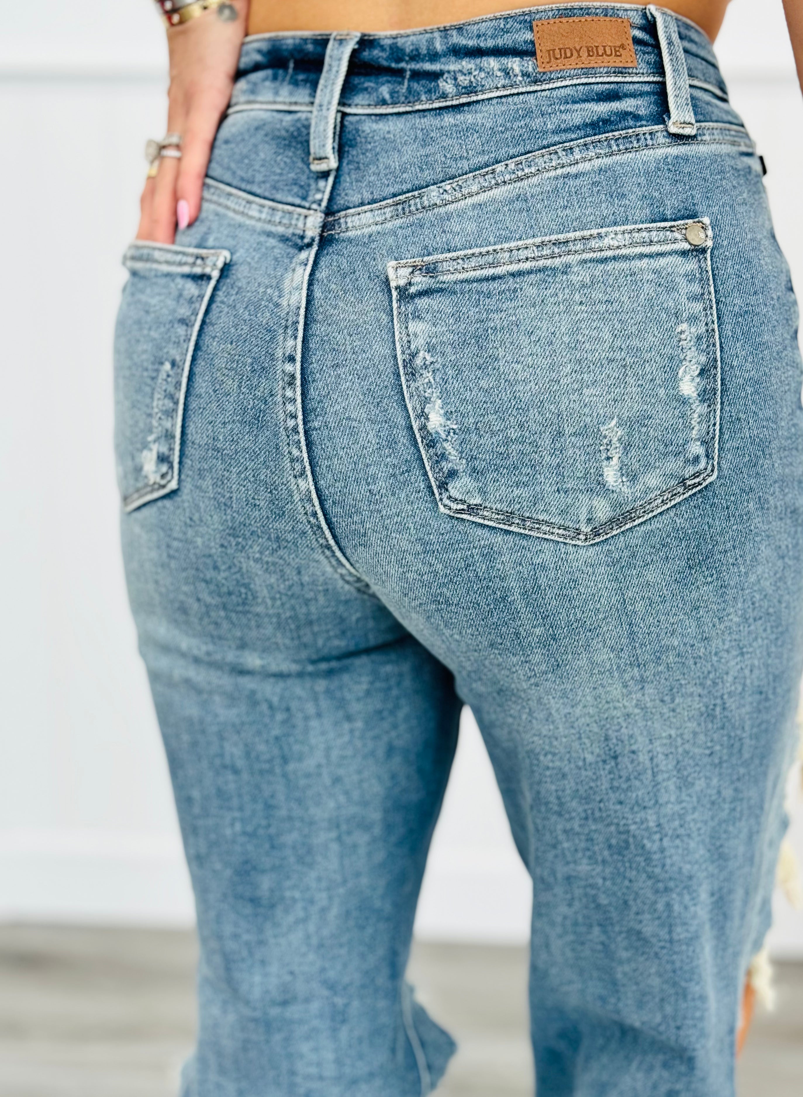 Knee ripped straight jeans