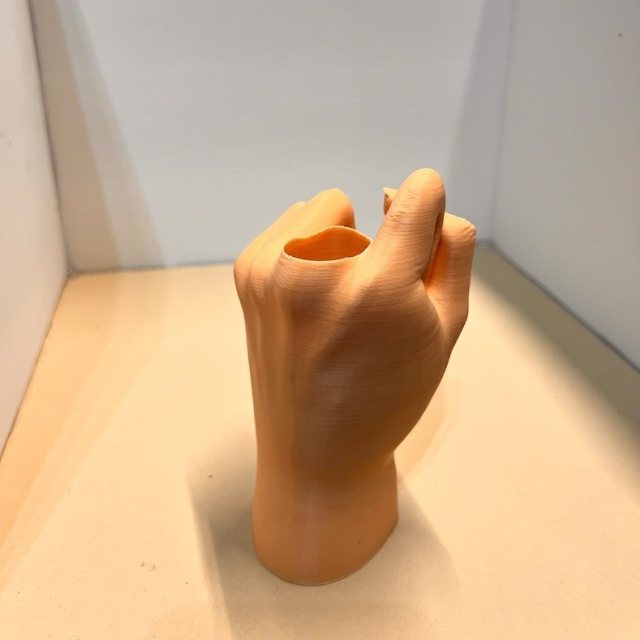 Collapsing Middle Finger Sculpture with Retractable Middle Finger