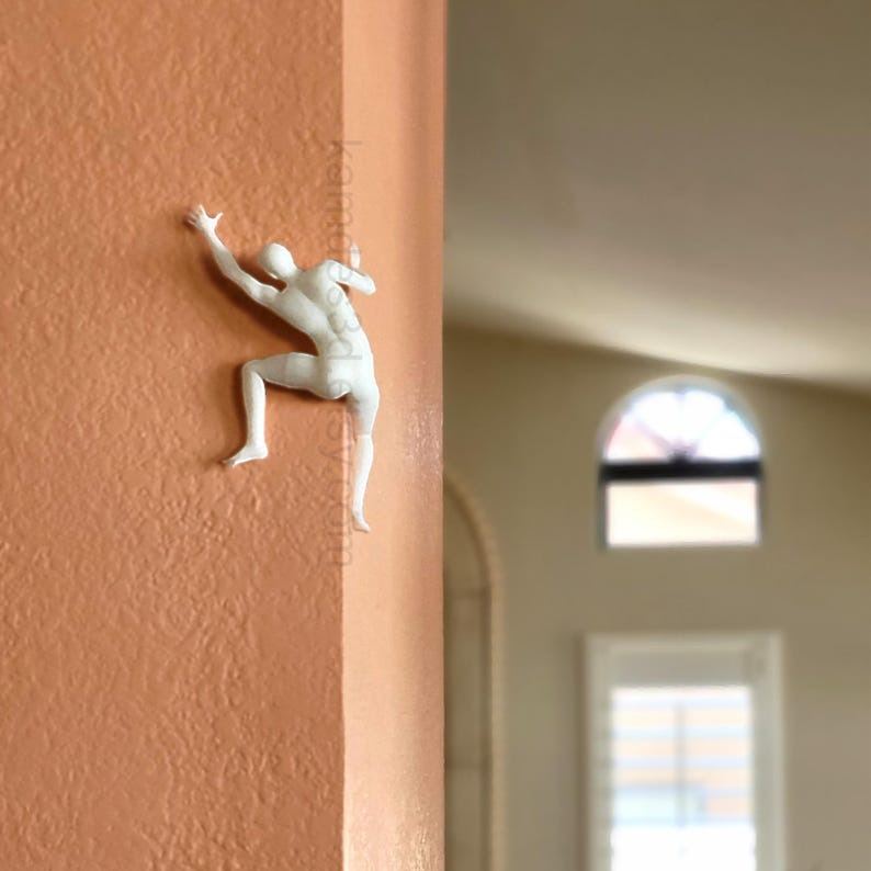 Mountain climber sculpture wall decoration
