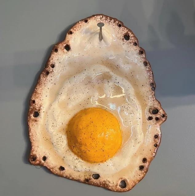 Fried Egg Hanging on a Nail