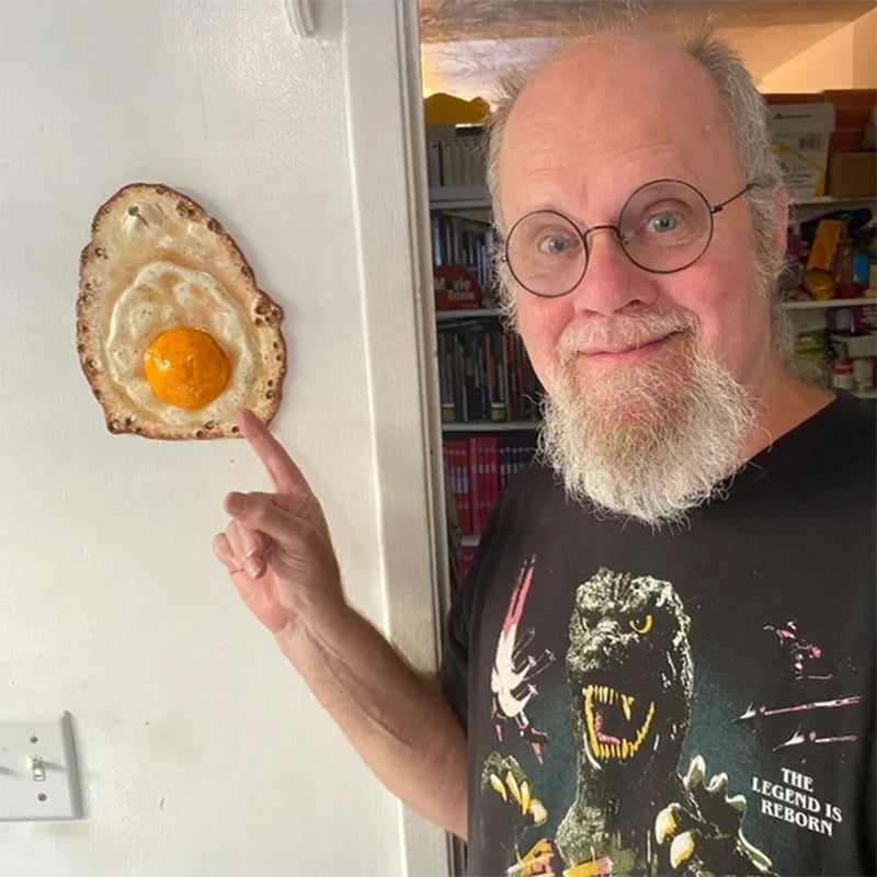 Fried Egg Hanging on a Nail