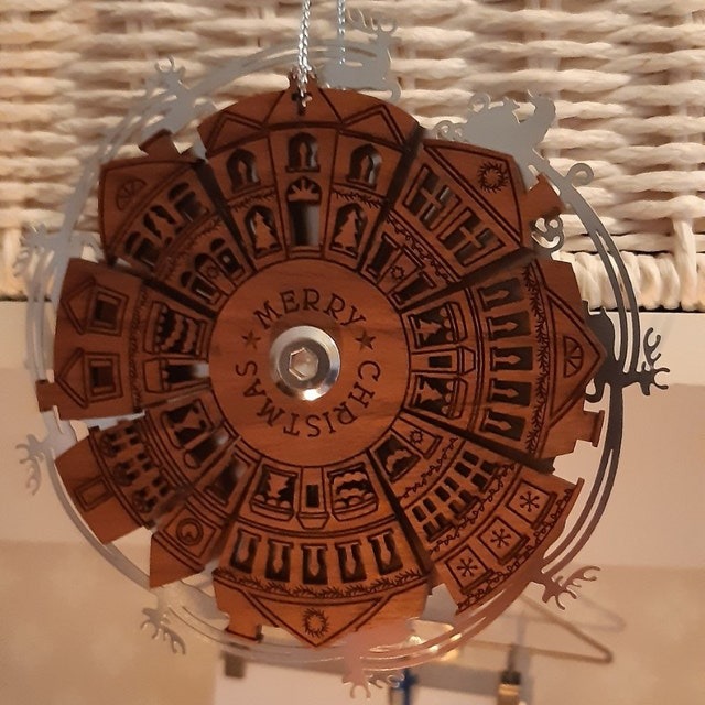 Spinning Santa Over Town Christmas Ornament
