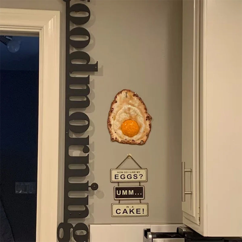 Fried Egg Hanging on a Nail