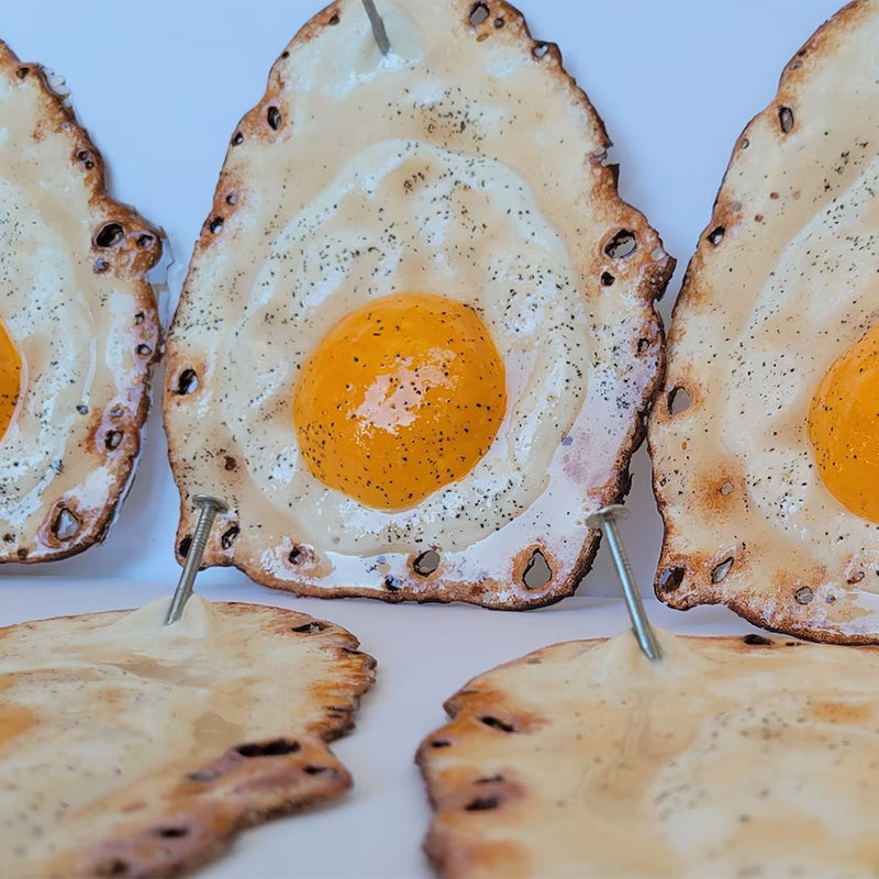 Fried Egg Hanging on a Nail