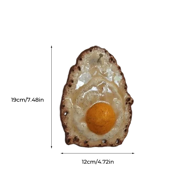 Fried Egg Hanging on a Nail