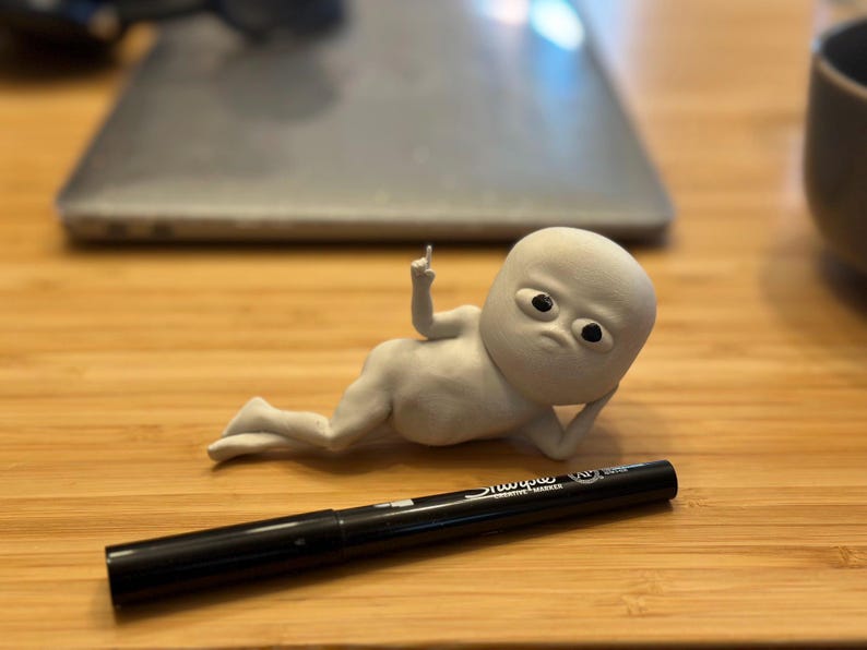 Fun Guy Lying Down Figurine