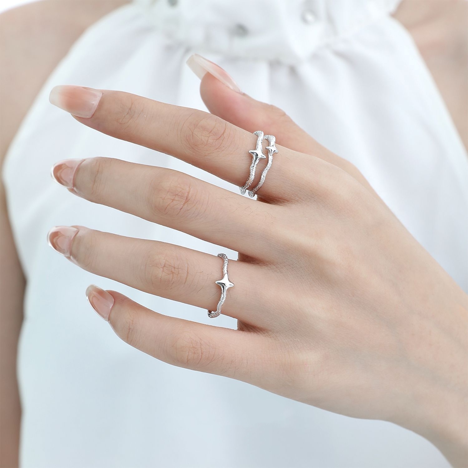 Starla N°6 and N°7 rings styled with other Starla rings, 925 sterling silver stackable star ring set on hand