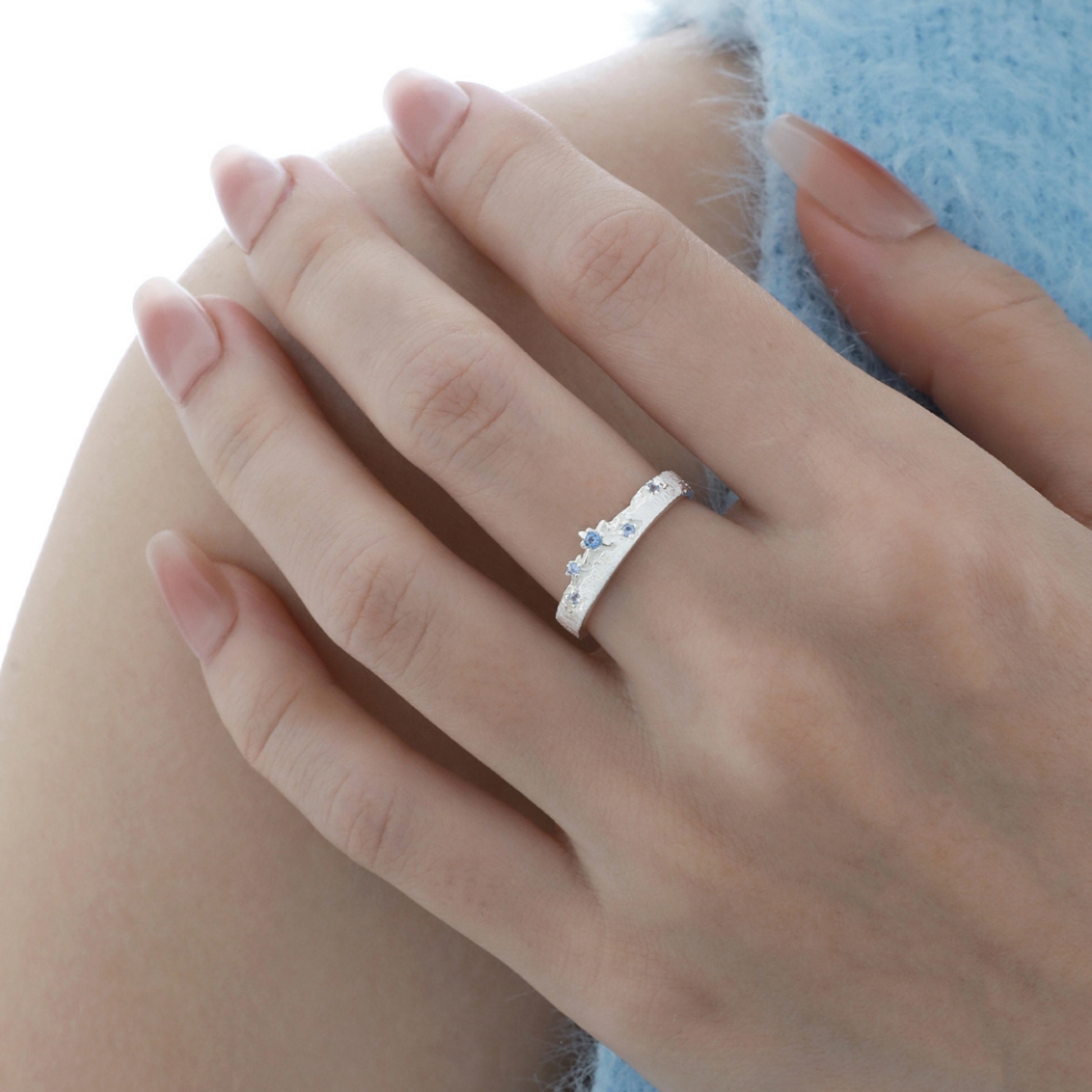 Aqua Ring styled on finger, sterling silver blue zircon ring