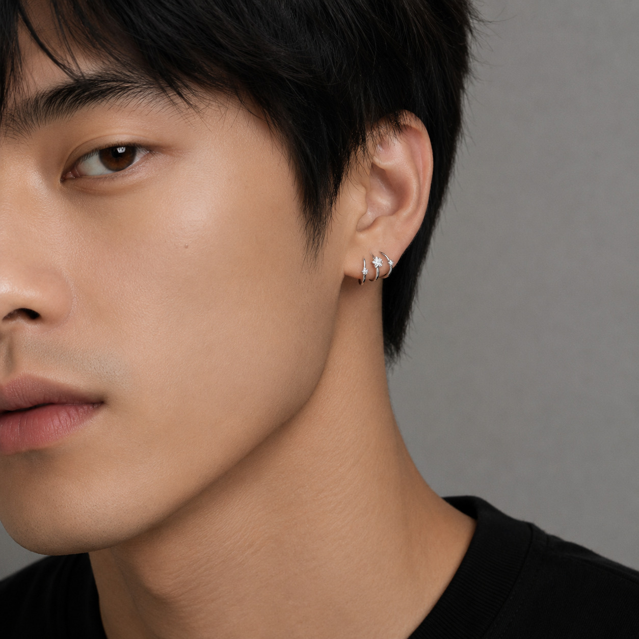 Dara N°4 925 sterling silver double huggie hoop earrings styled on a male model