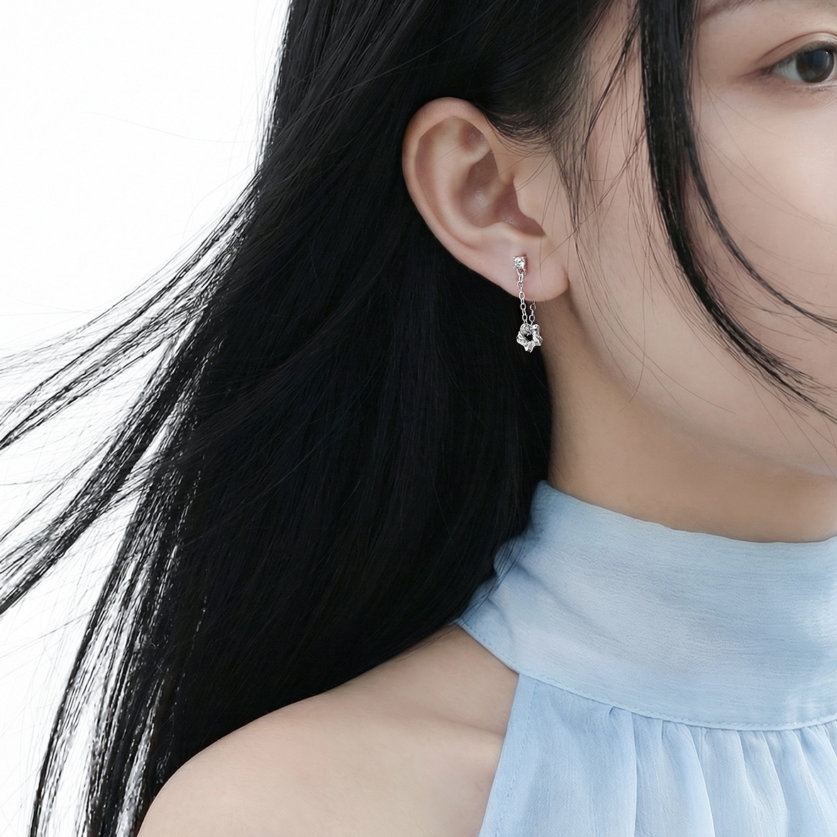Dara N°7 silver drop earrings on female model