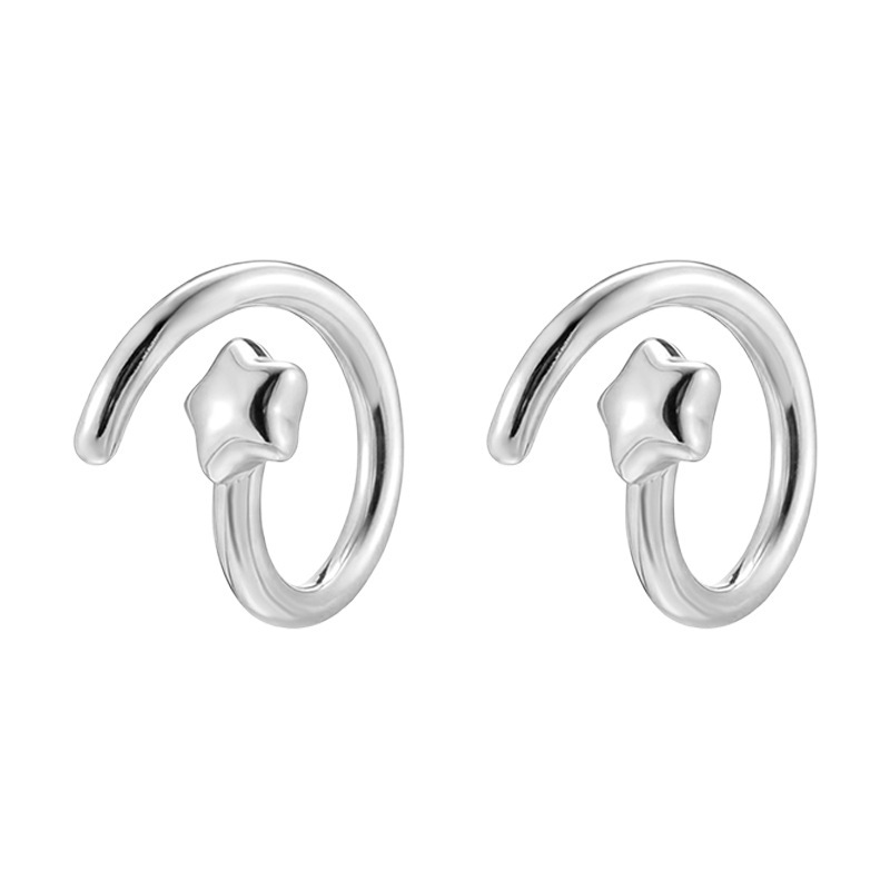 Dara N°9 silver star ear studs with a sculptural curved design