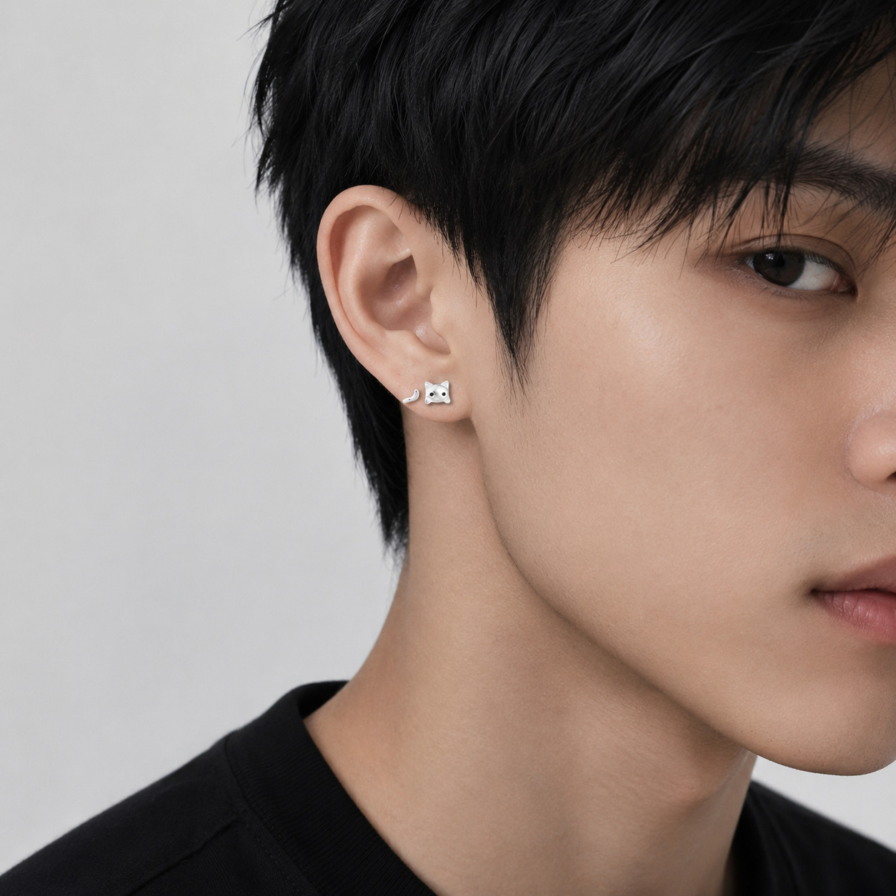 Kitty N°2 Ear Studs wearing on a male model's ear