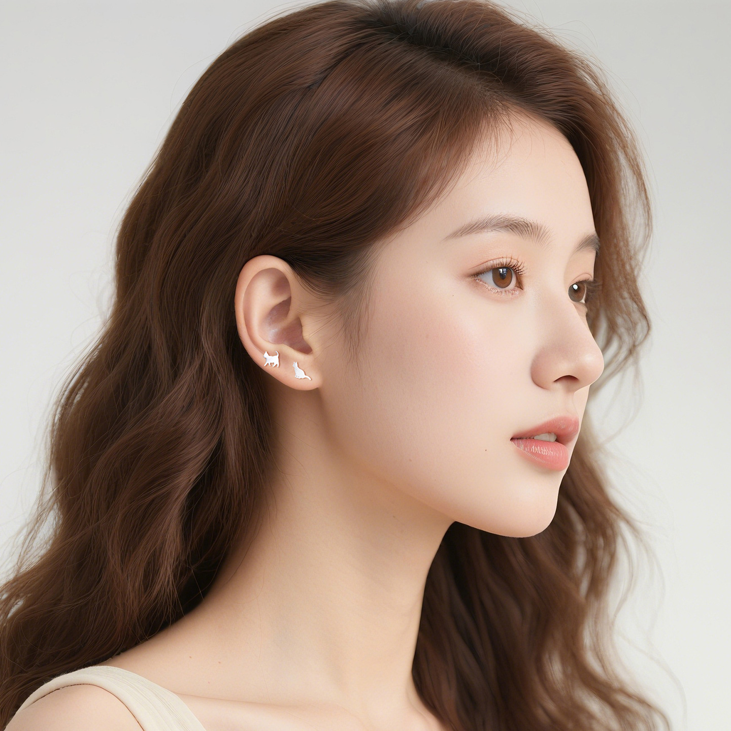 Woman wearing Kitty N°3 Ear Studs, side profile view