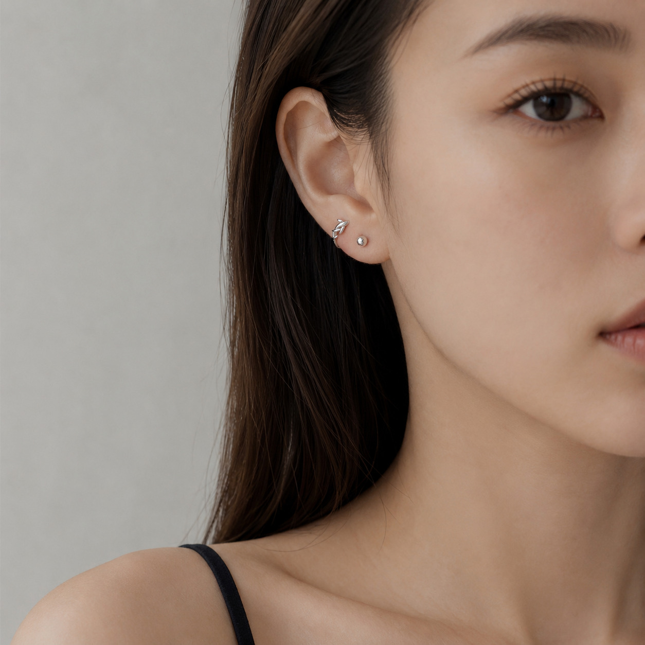 Moana N°2 Ear Studs on an Asian female model, Pisces-inspired jewelry