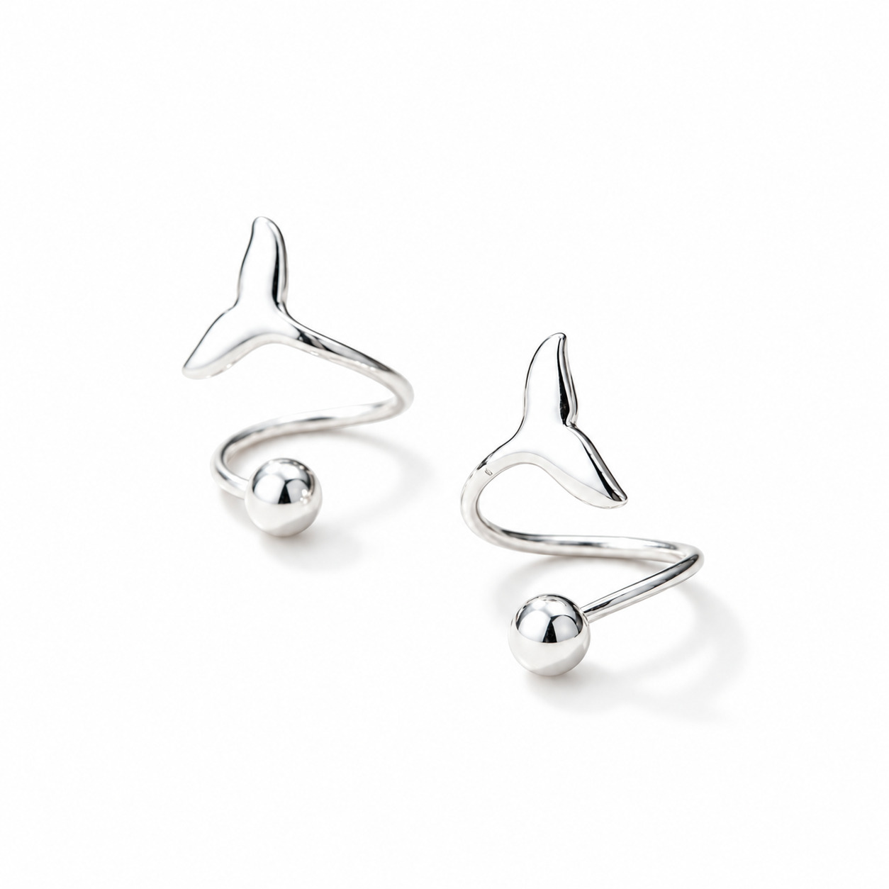 Moana N°3 sculptural silver spiral ear studs with polished spherical ends